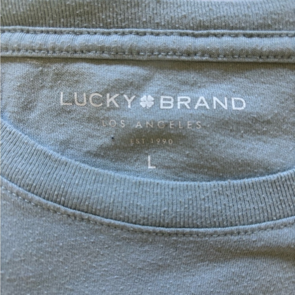 ⭐️ 4 for $20 - Bundle and save!!! ⭐️
Lucky Brand Men's Light Gray Graphic Tee - Picture 3 of 5